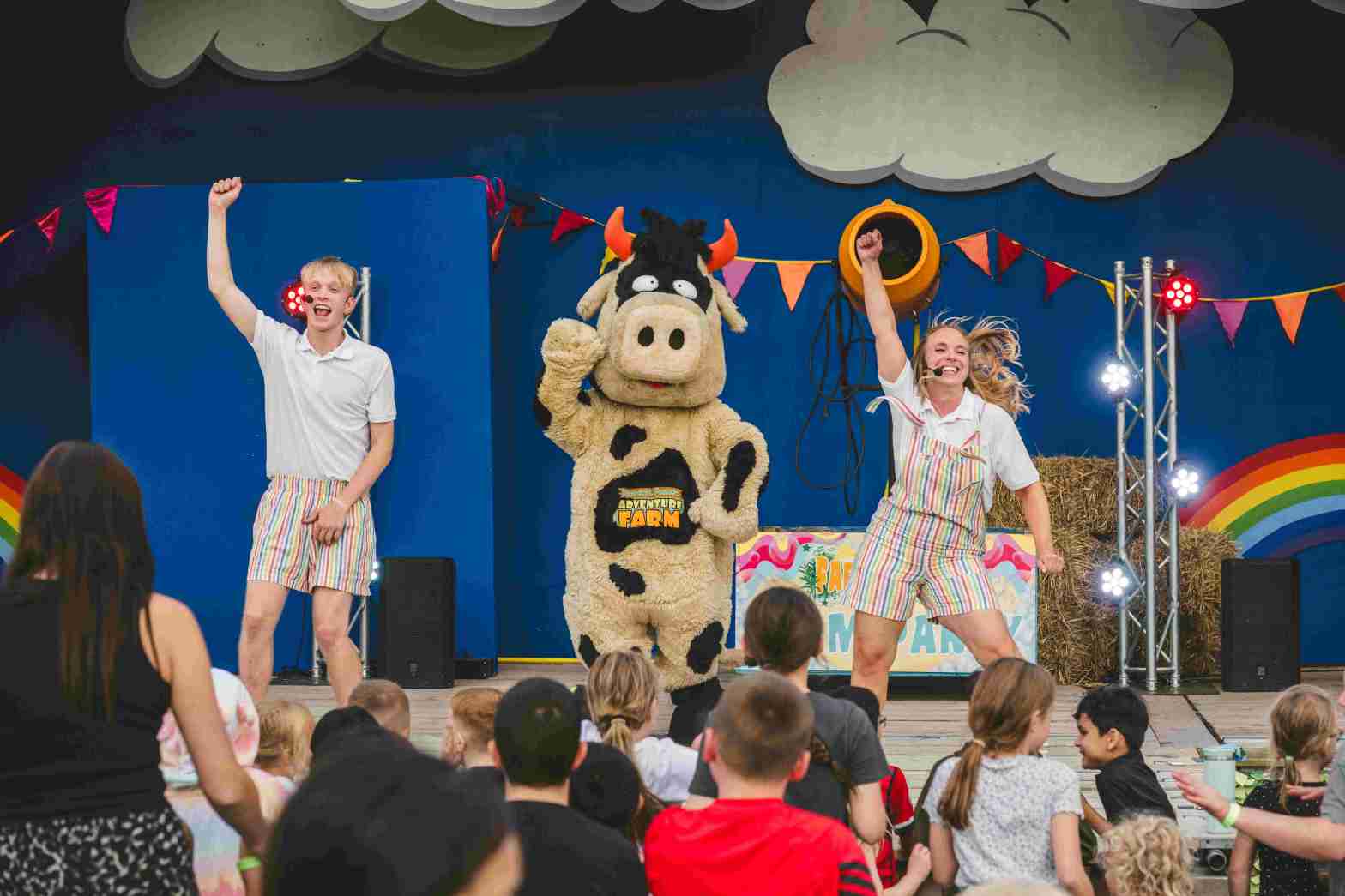 entertainers on stage at a festival